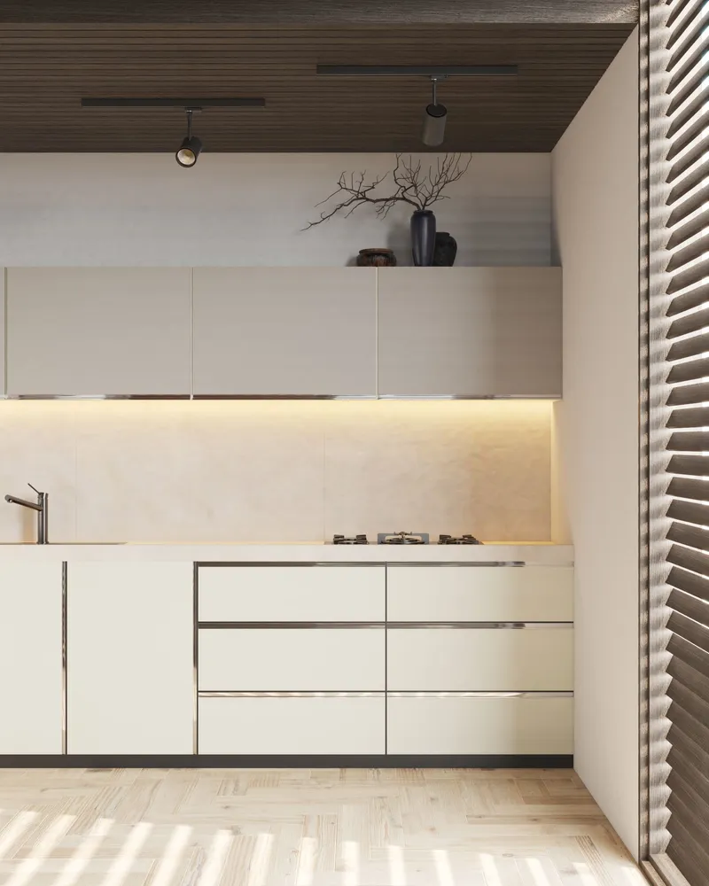 A finished kitchen detail shows flush cabinet fronts, a light countertop, under-cabinet lighting, and wood flooring.